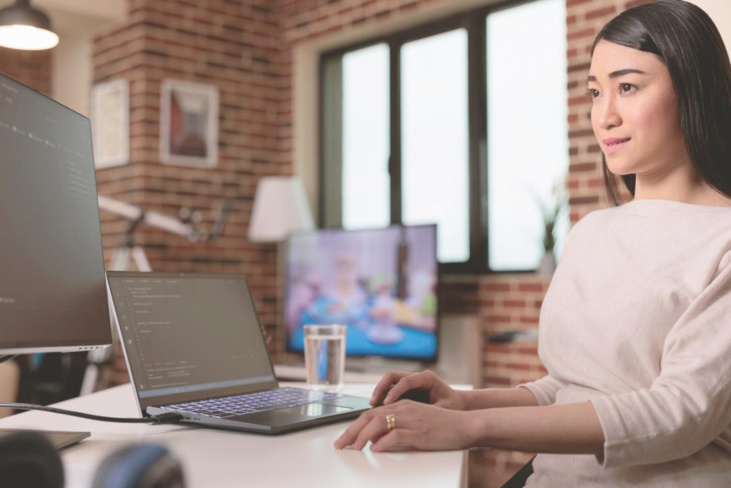 Developer working on blockchain code with multiple screens showing smart contracts and testing environments